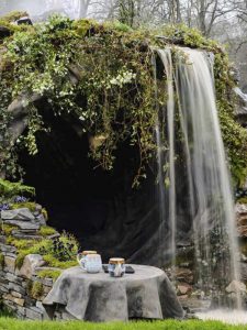 RHS Garden Design with waterfall and cave by Evergreen Wales RHS Cardiff Flower Show (12th-13th April 2018)