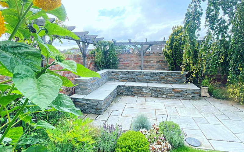 Beautiful stonework wall and seating in Penarth, designed and built by Evergreen wales
