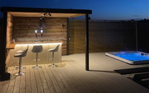 Outdoor landscaping of decking and timer work for outside bar, seating and hot tub installation by EvergreenWales in Sully, Penarth