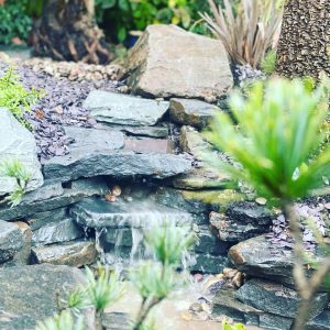 Water features designed and built by Evergreen Wales using natural stone and slabs