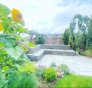 Stone walls, built beautifully into your garden to create soft edging and patio styling. Designed and built by landscaping company, EvergreenWales.