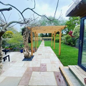 Patios, turfing and trellis building, all part of the design from EvegreenWales