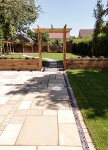 Pergola entrance with new patio, freshly laid turf and planters in Cyncoed Cardiff