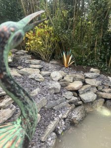 Natural stone water feature with stork ornament
